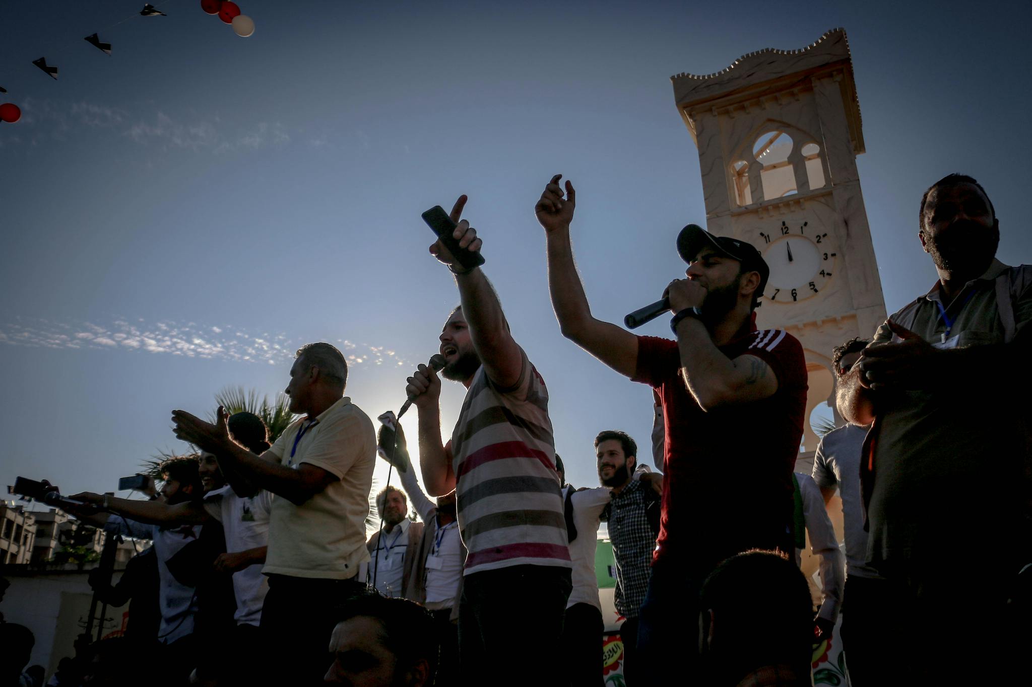 Ethnic men singing songs at event