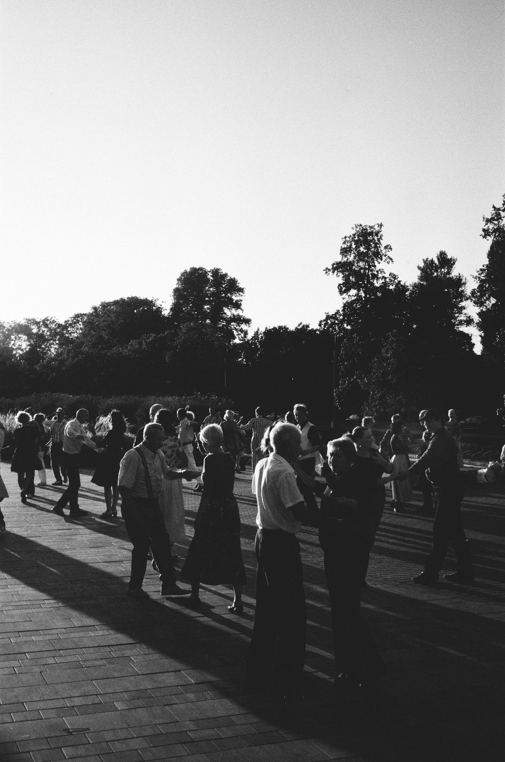 Grayscale Photo of People Dancing