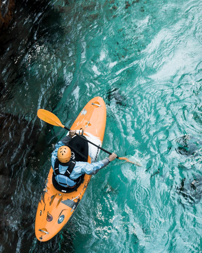 Photo Of Person Riding Kayak